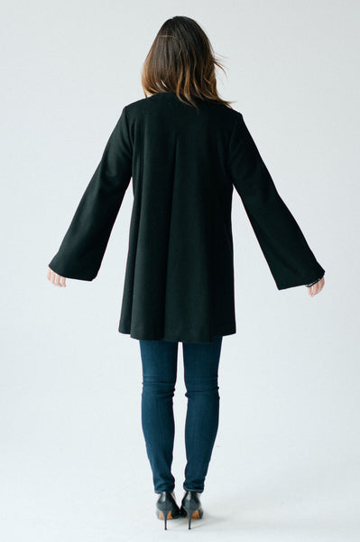 Cape coat in black by Elizabeth Geisler with Cocoon