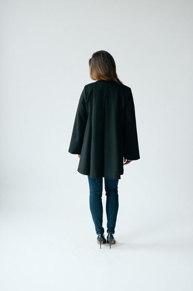 Cape coat in black by Elizabeth Geisler with Cocoon